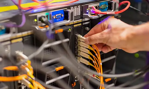 Technician installing network cabling